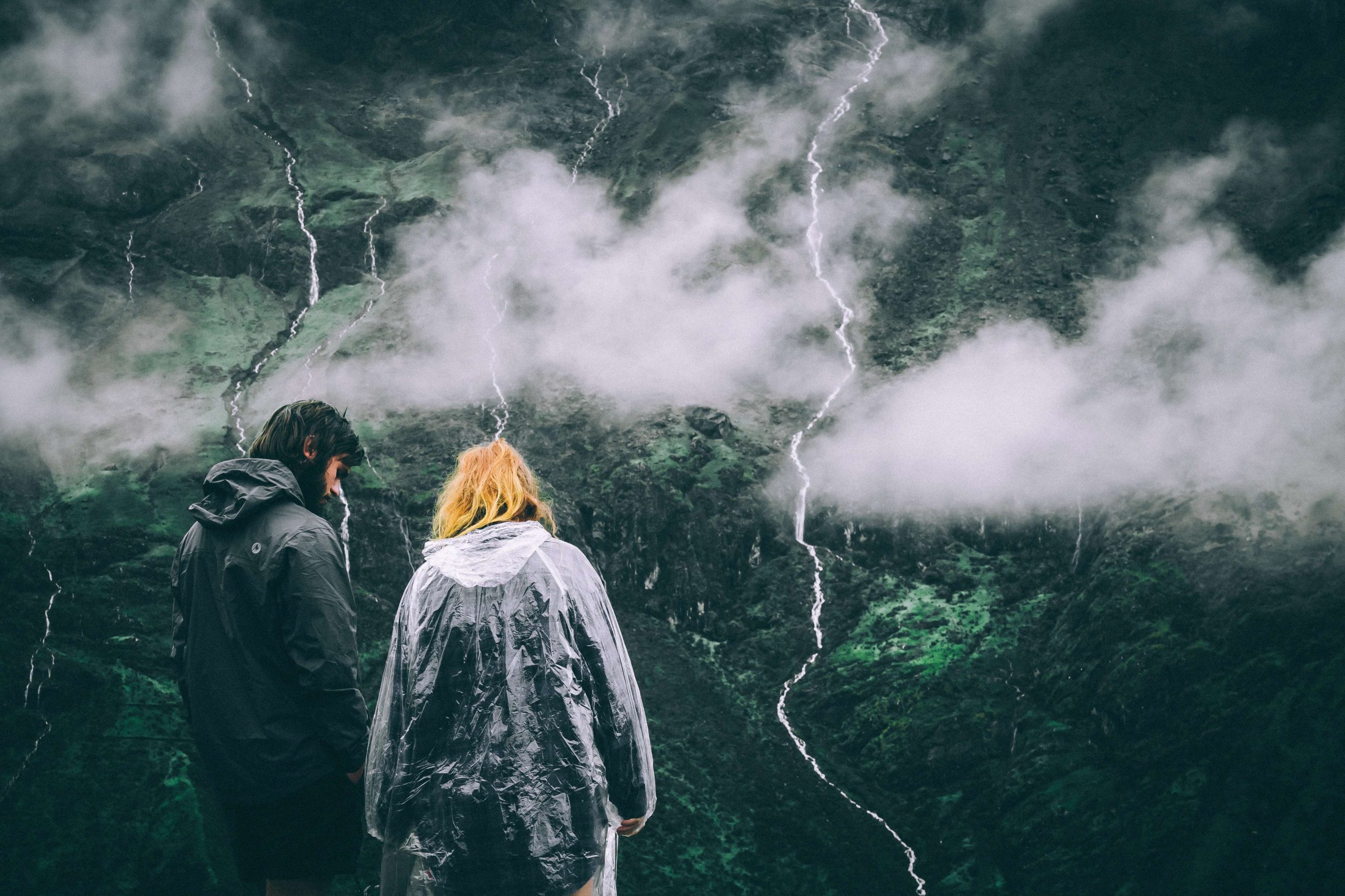 Man & Woman High Up in Mountains