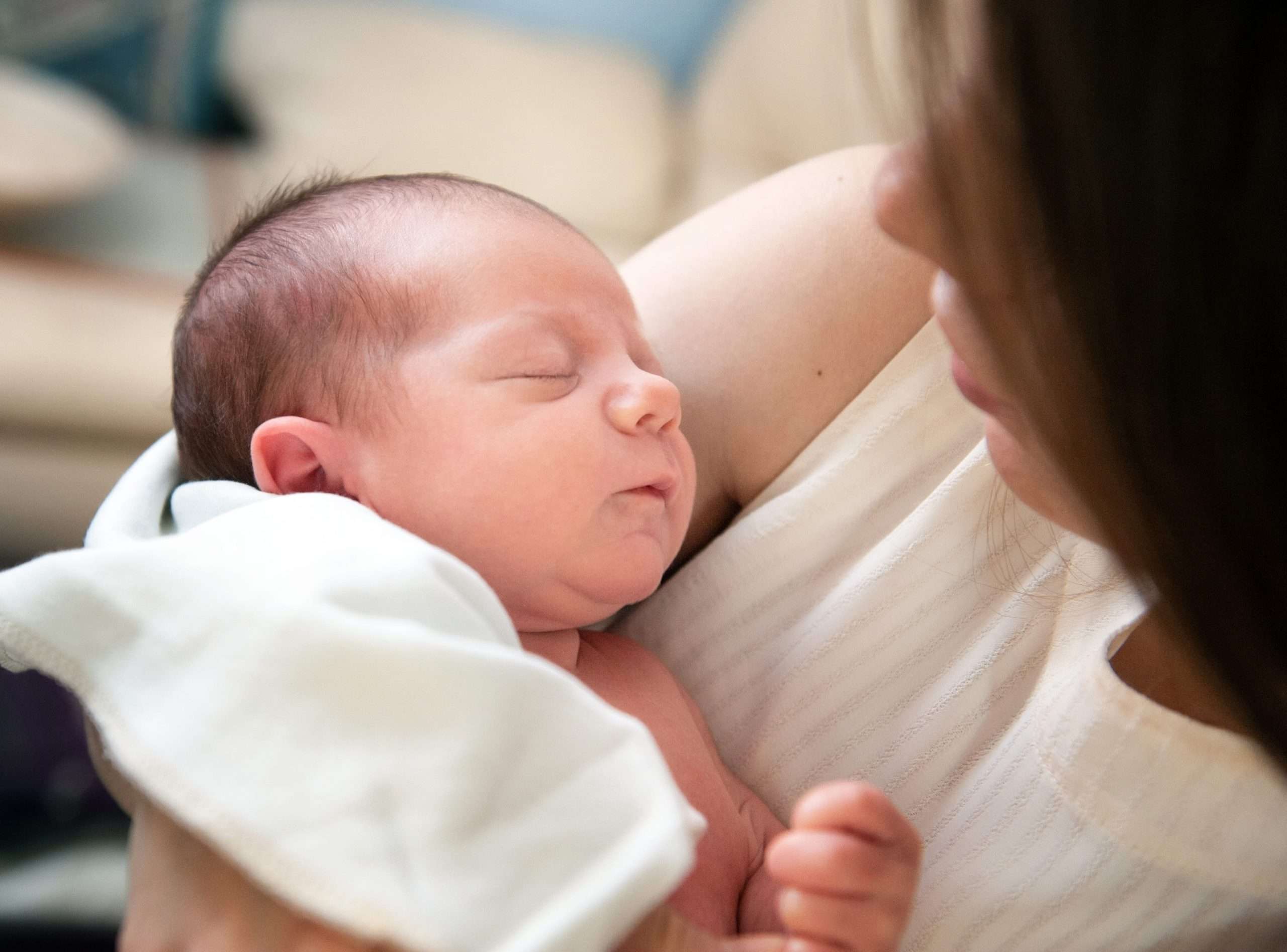 Mom looking at new baby